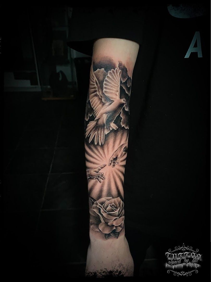 a black and white cover-up tattoo with a dove and roses, mainz-bingen, germany