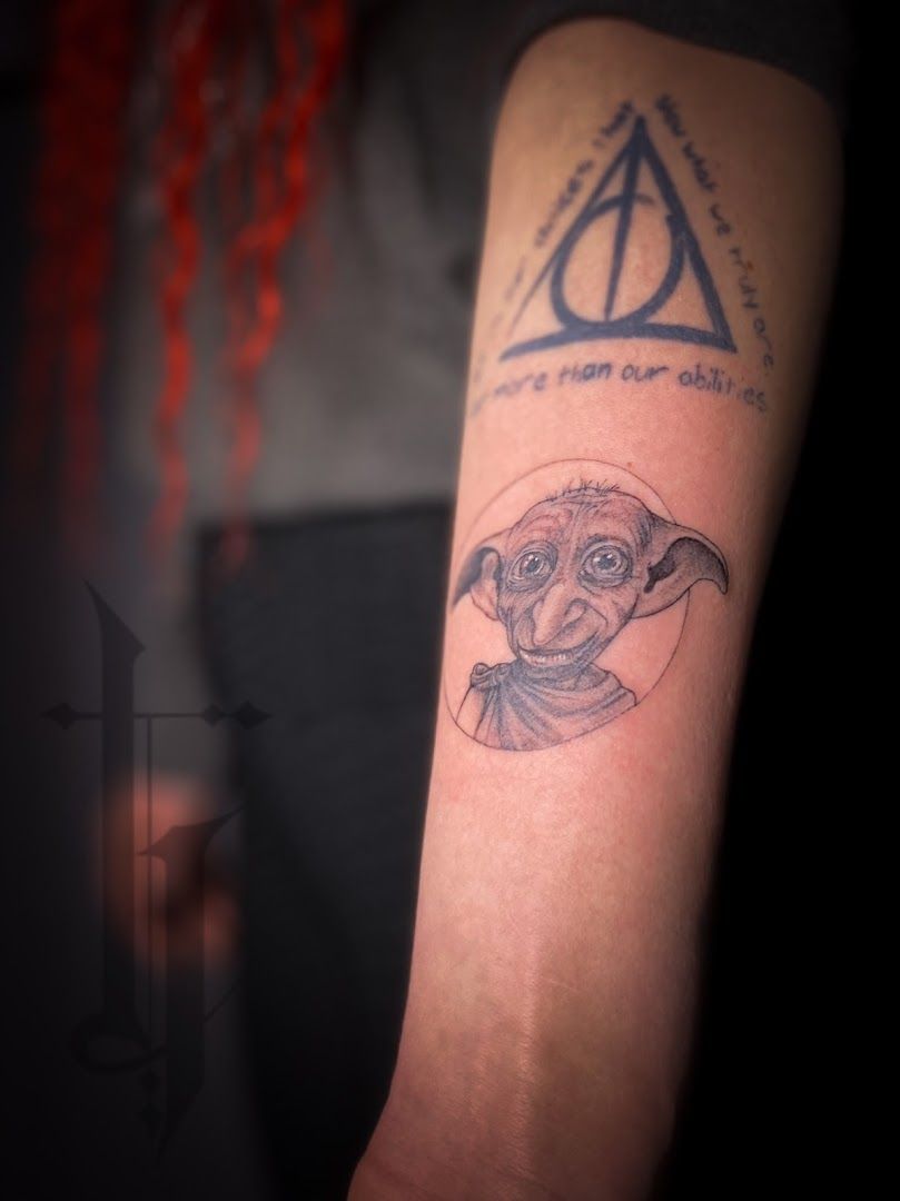 a narben tattoo of an owl with a harry's hat on it, schwalm-eder-kreis, germany