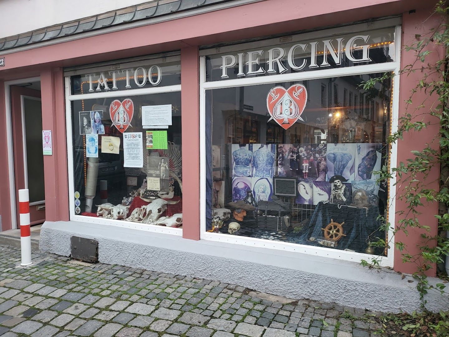 a storefront with a window display of various items