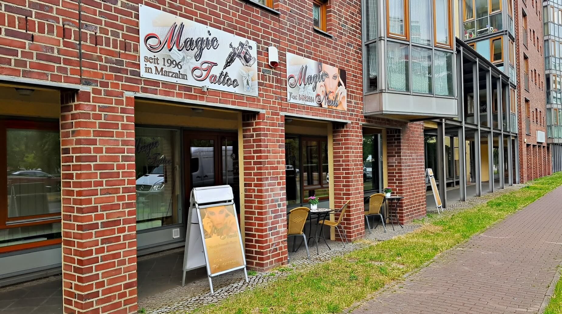 a brick building with a sign on the side