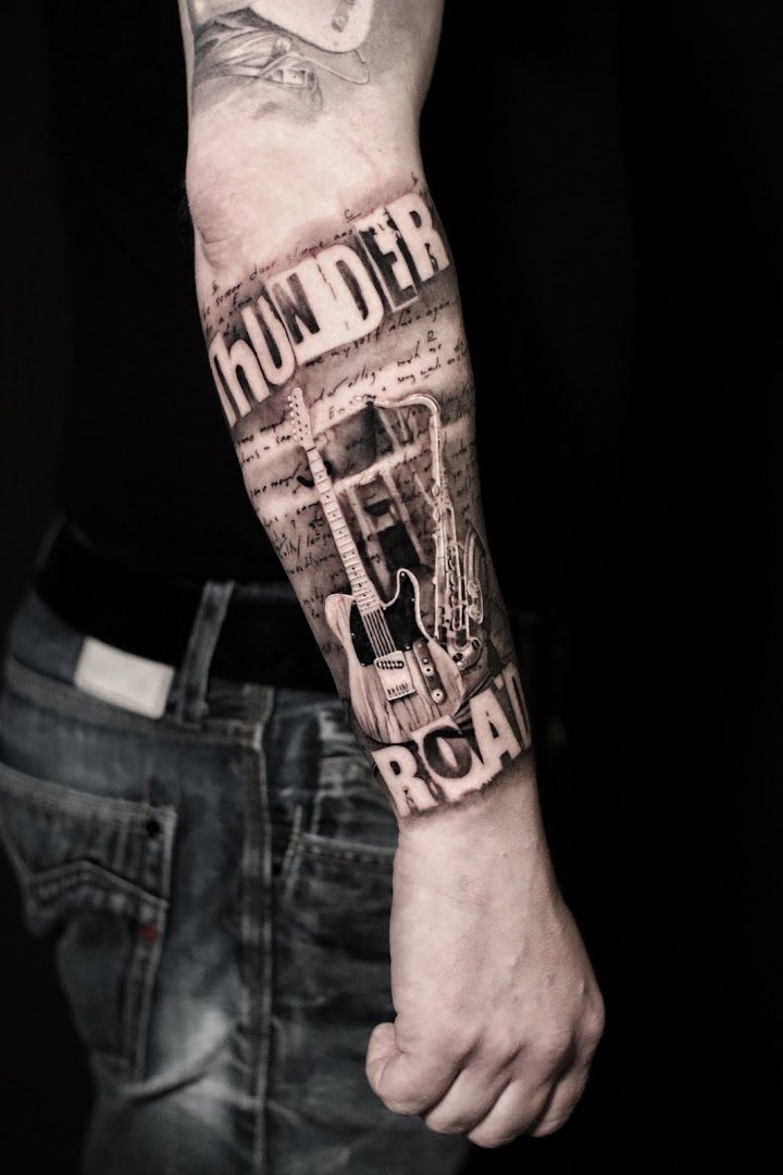 a man's arm with a cover-up tattoo of a cityscar, pinneberg, germany