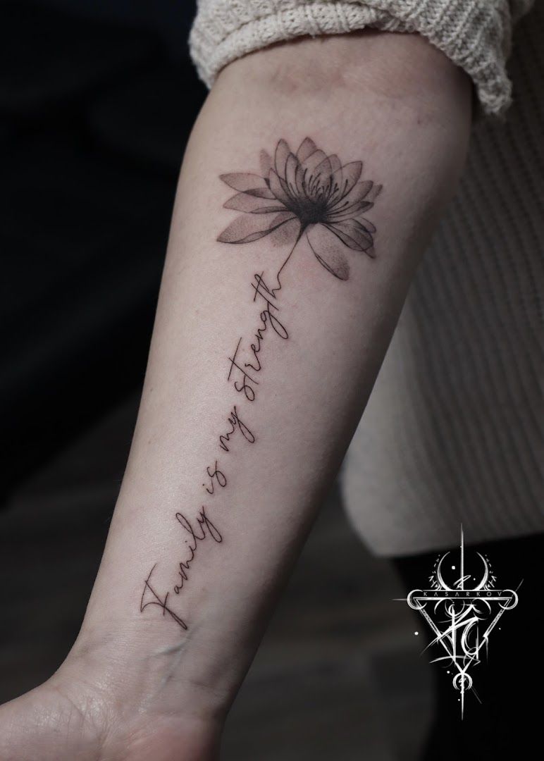 a cover-up tattoo with the words, ` ` ` and a lotus flower, rhein-erft district, germany