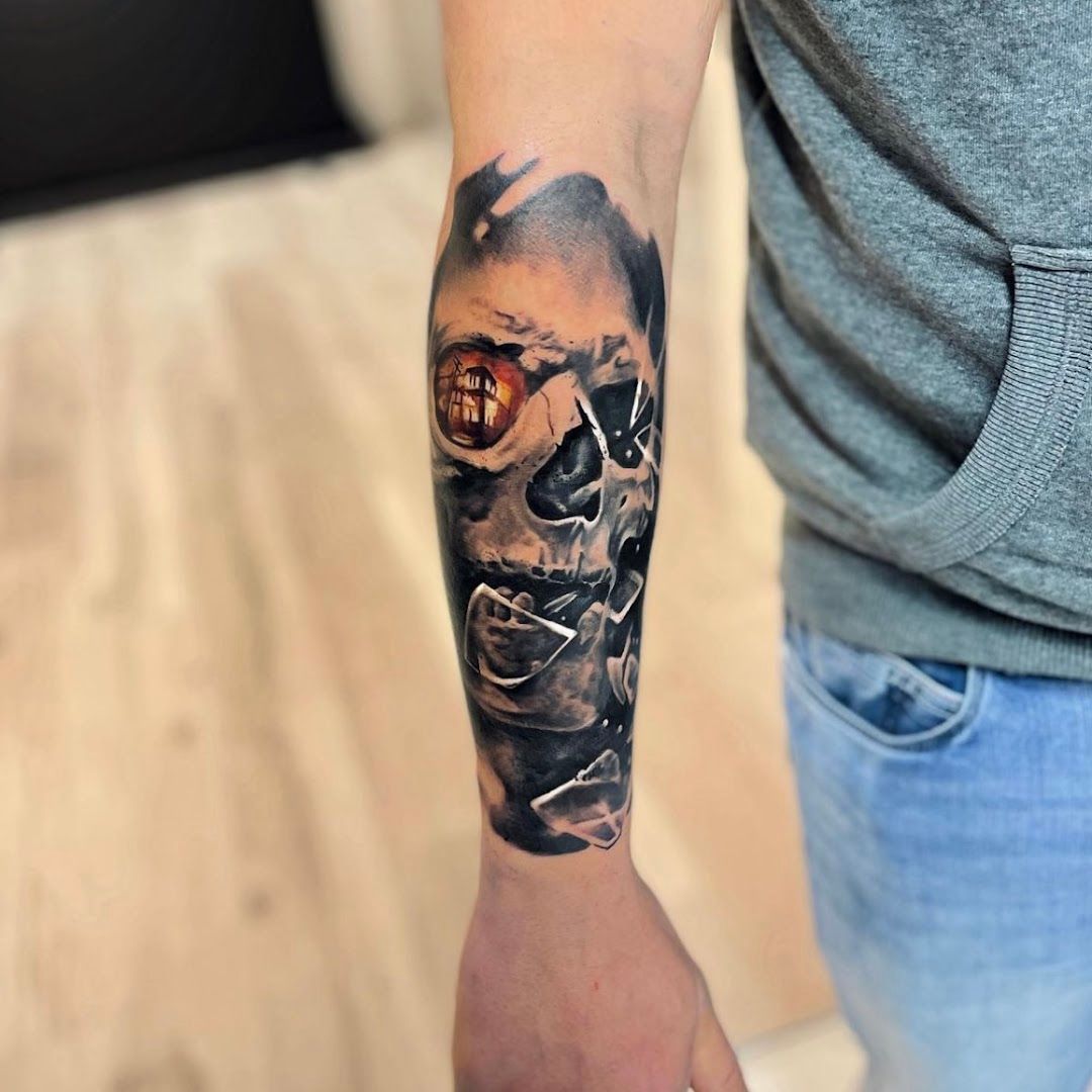 a man with a skull blackwork tattoo on his arm, zollernalbkreis, germany
