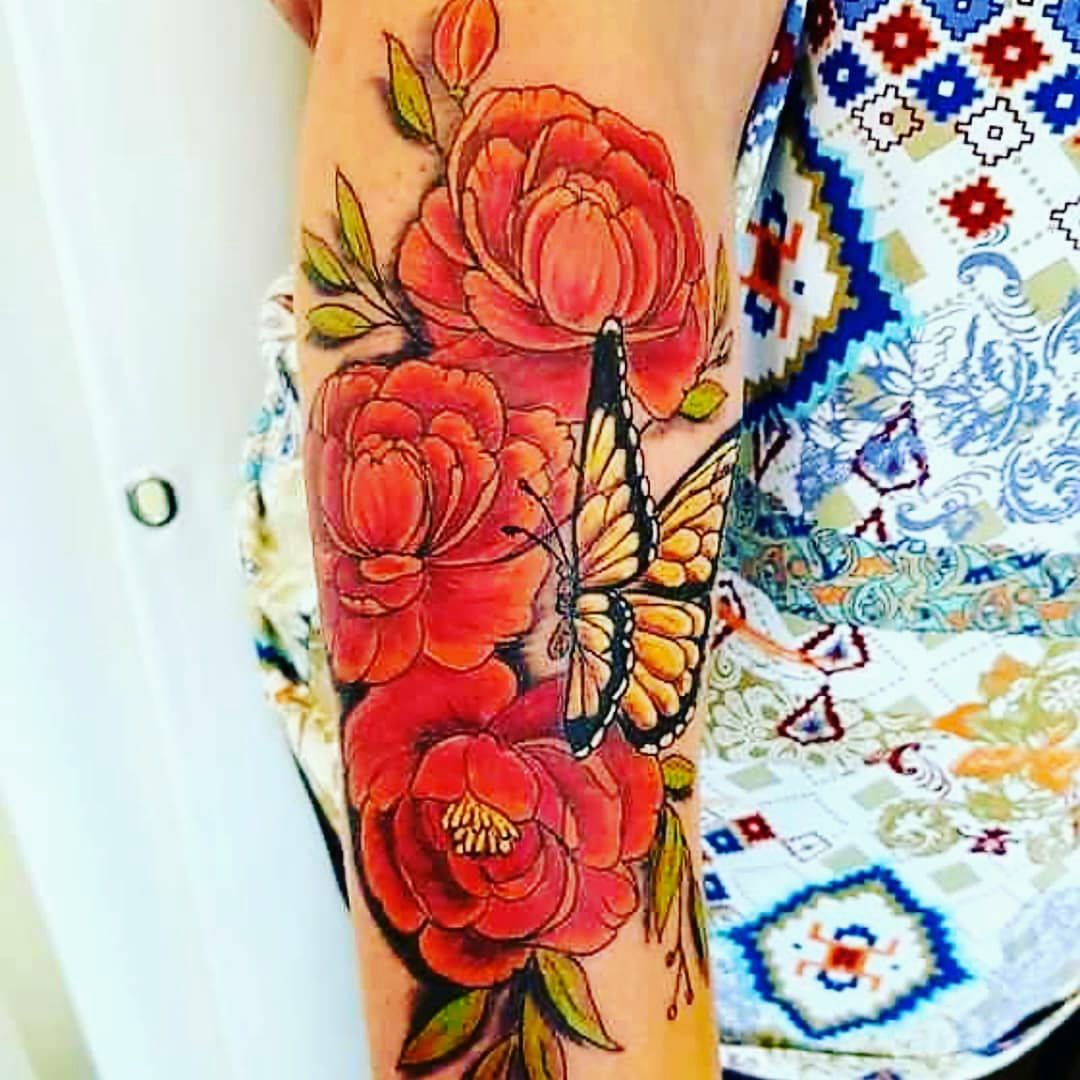 a woman with a cover-up tattoo on her arm, rastatt, germany