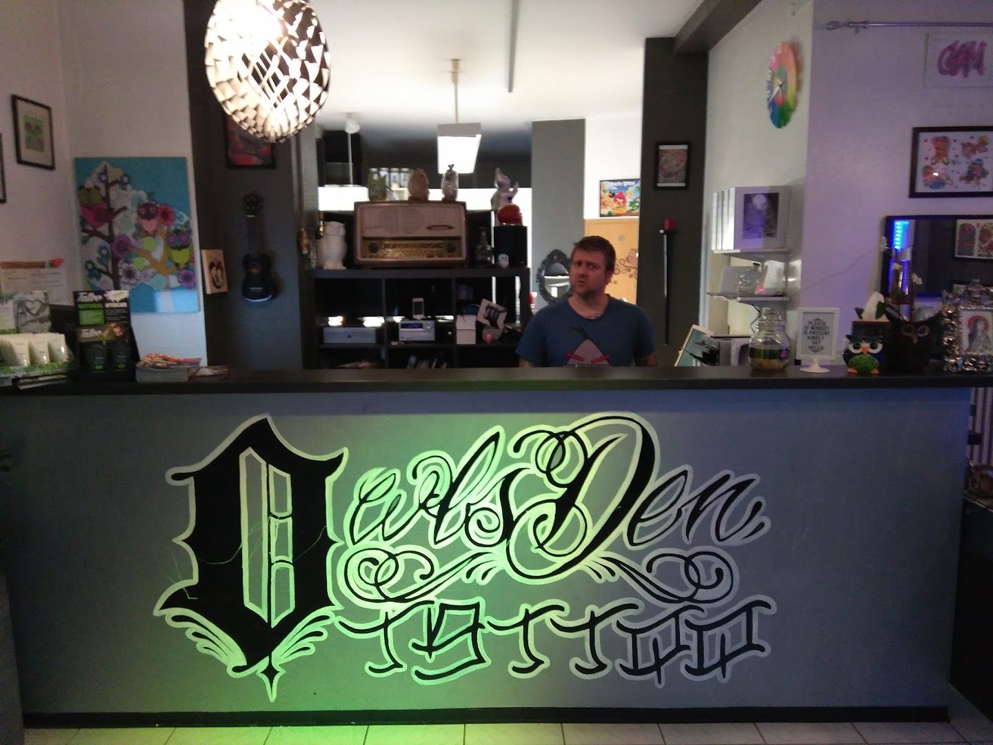 a man sitting at the front desk of a restaurant