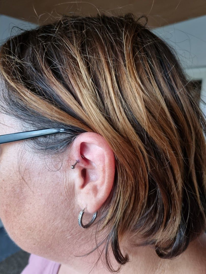 a woman with a pair of glasses on her ear