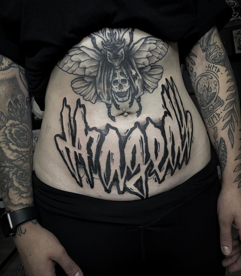 a woman with a cover-up tattoo on her stomach, zwickau, germany