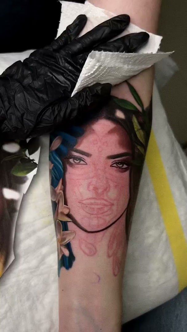 a woman's face portrait tattoosed on the arm, kreisfreie stadt karlsruhe, germany