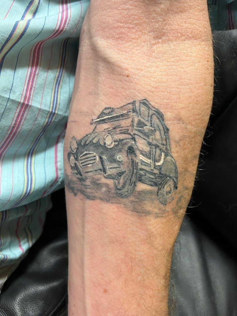 a cover-up tattoo of a car on the arm, bonn, germany