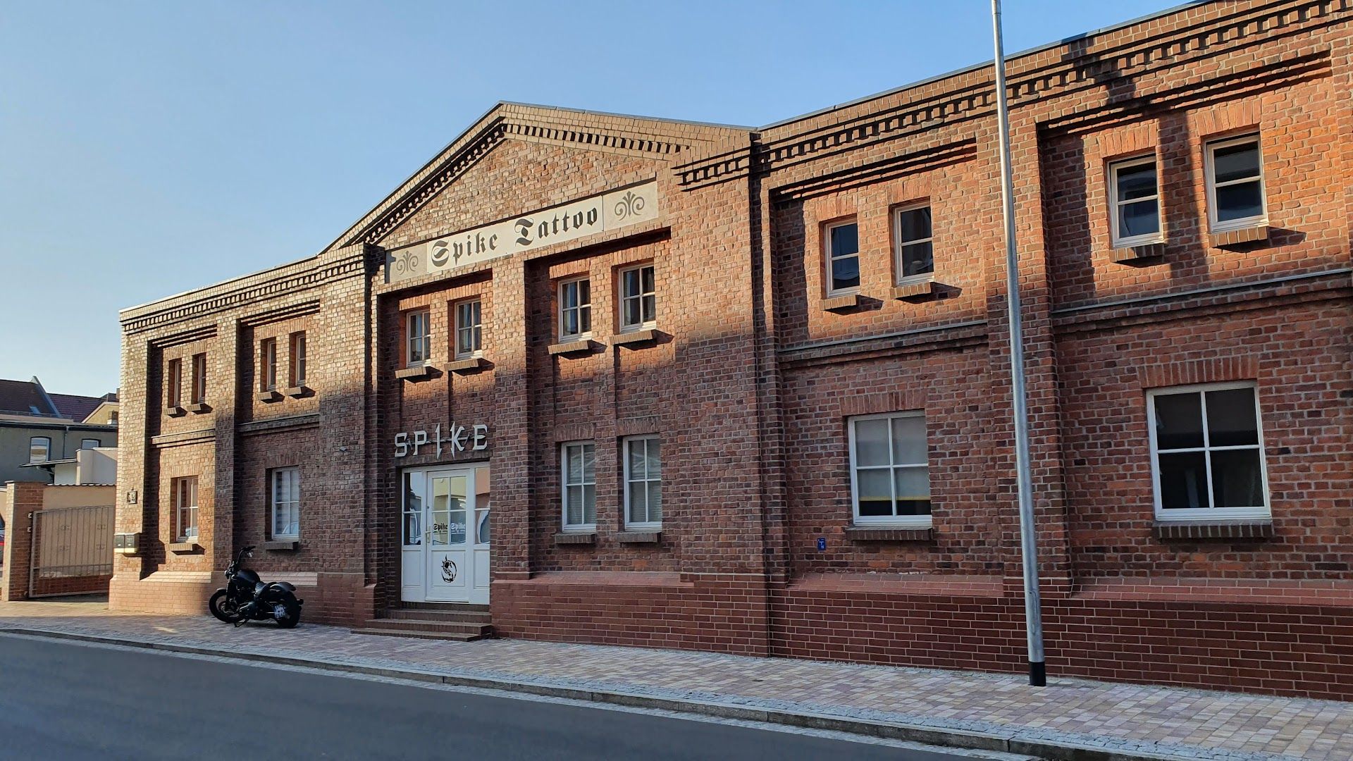 a brick building with a sign on the front