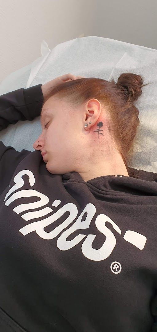 a woman laying on a bed with her head in her hands