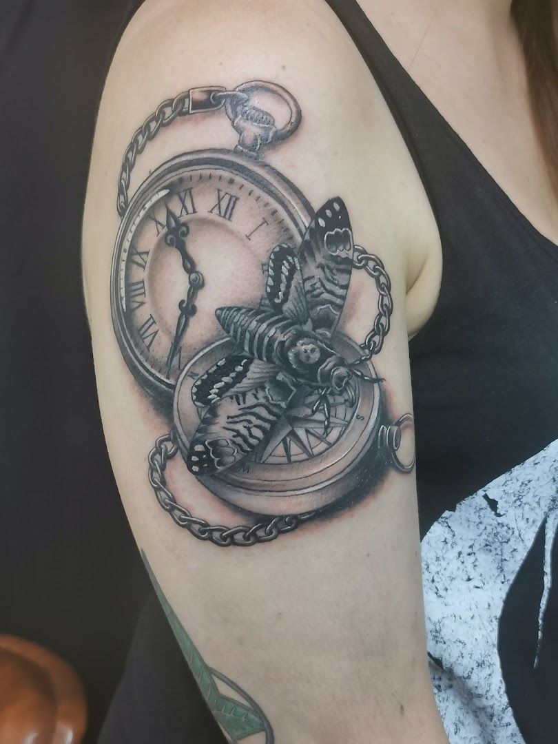 a woman with a clock japanische tattoos in leipzig on her arm, lahn-dill-kreis, germany