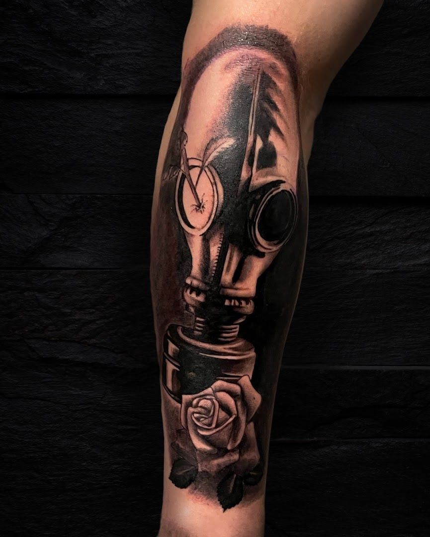 a cover-up tattoo of a gas mask with roses on the leg, karlsruhe, germany