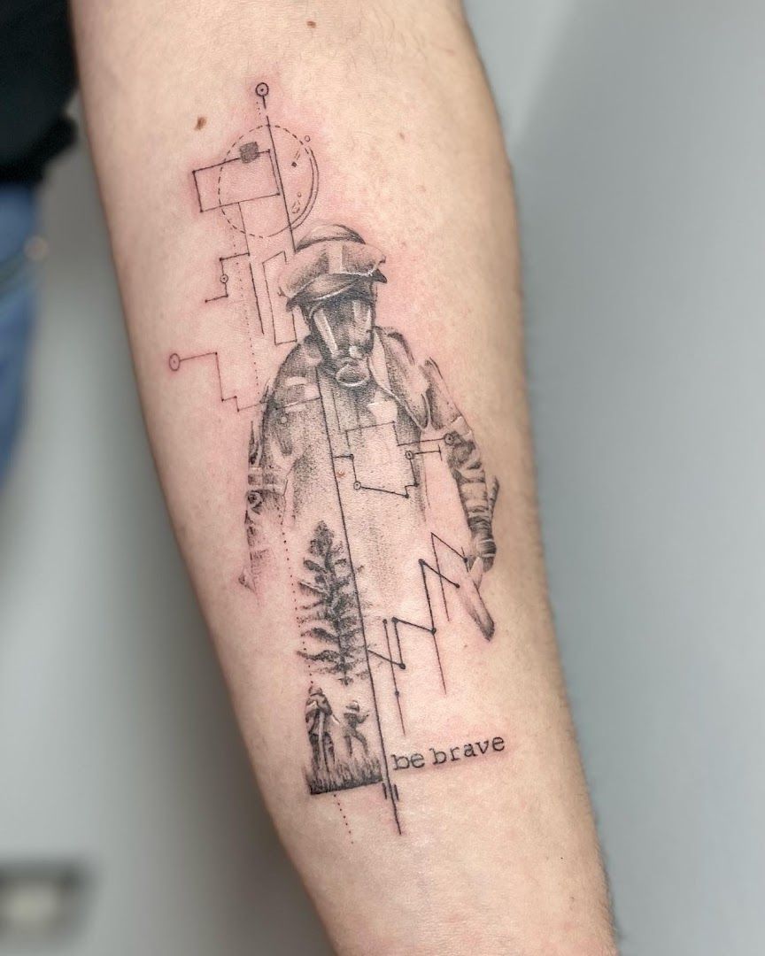 a man's arm with a narben tattoo of a man in a hat and a map, lahn-dill-kreis, germany