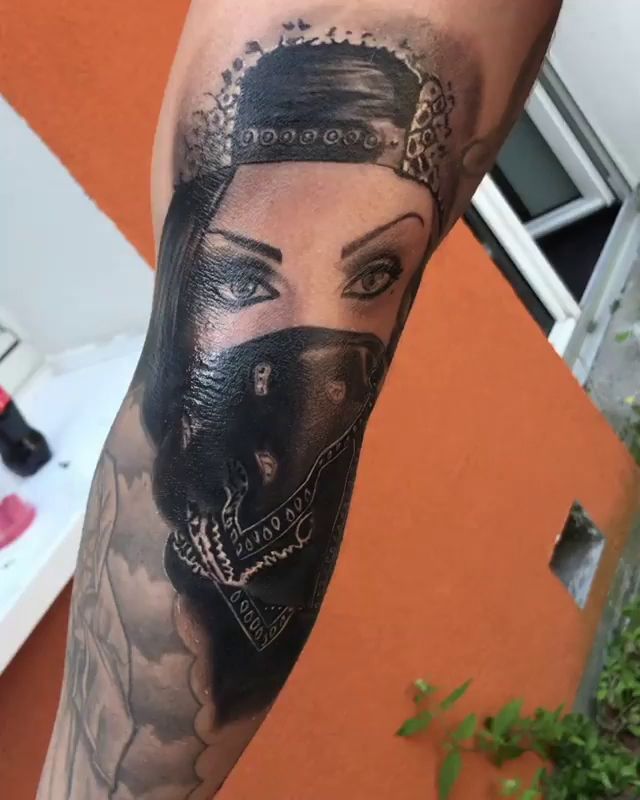 a woman with a crown cover-up tattoo on her arm, kreisfreie stadt freiburg im breisgau, germany