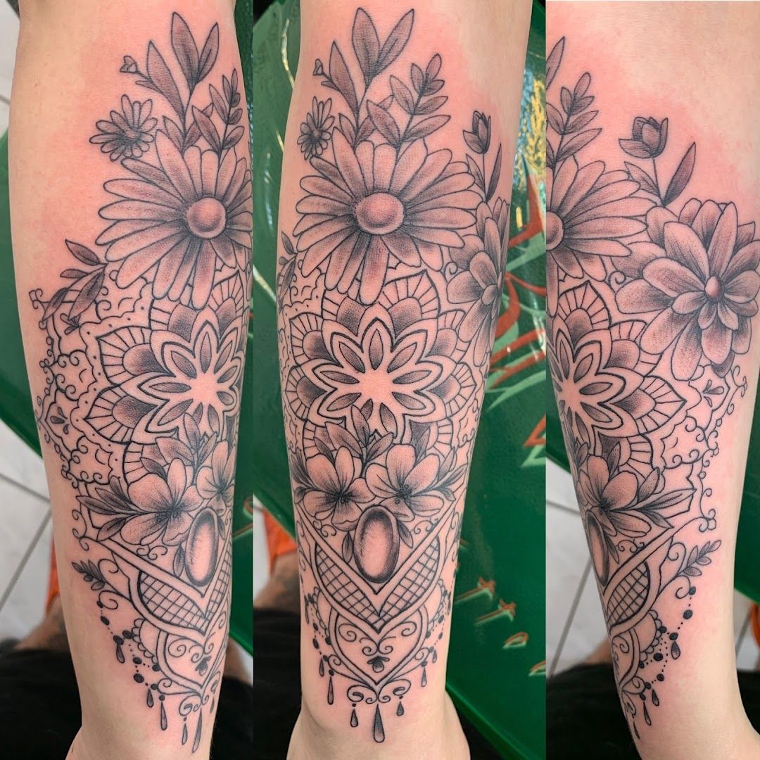 a black and white cover-up tattoo of flowers and hearts, ludwigsburg, germany