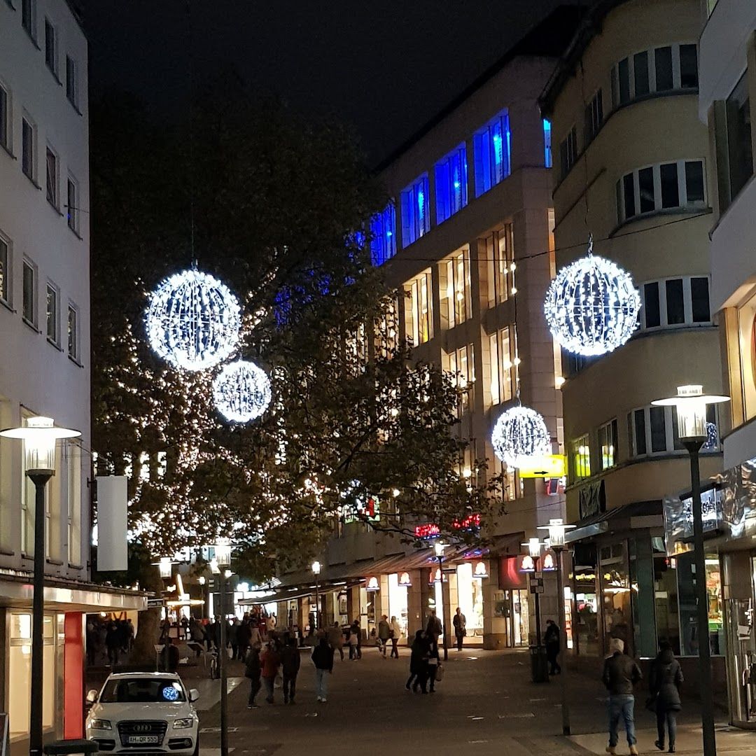 a street with many people walking down it