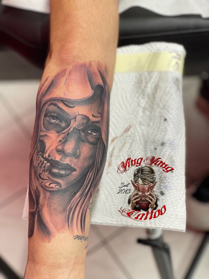 a narben tattoo of a woman with a skull on her arm, berlin, germany