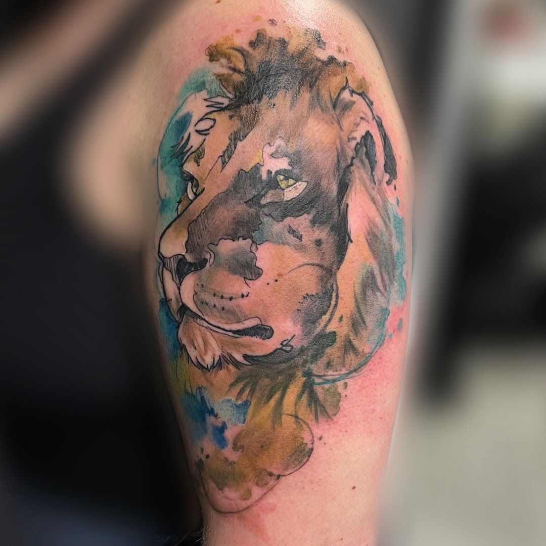 a cover-up tattoo of a lion on the arm, chemnitz, germany