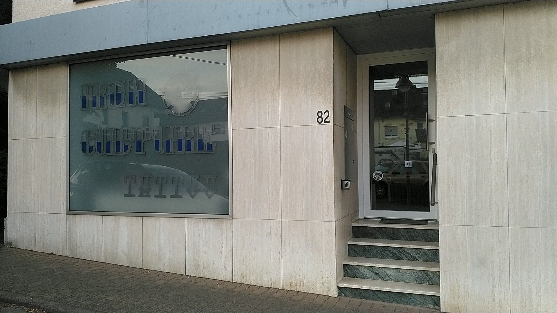 a building with a sign that says the entrance to the building