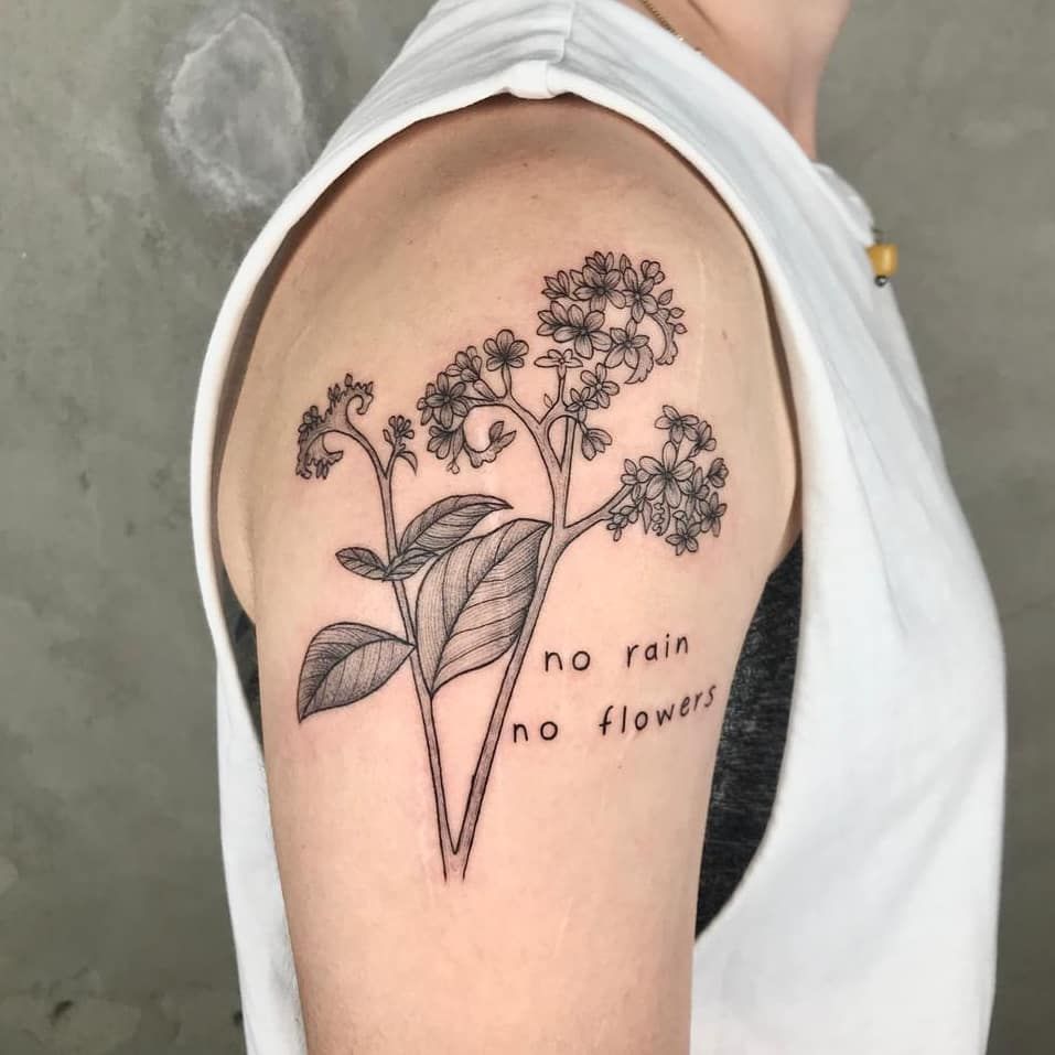 a black and white narben tattoo of a flower with the words no rain, bonn, germany