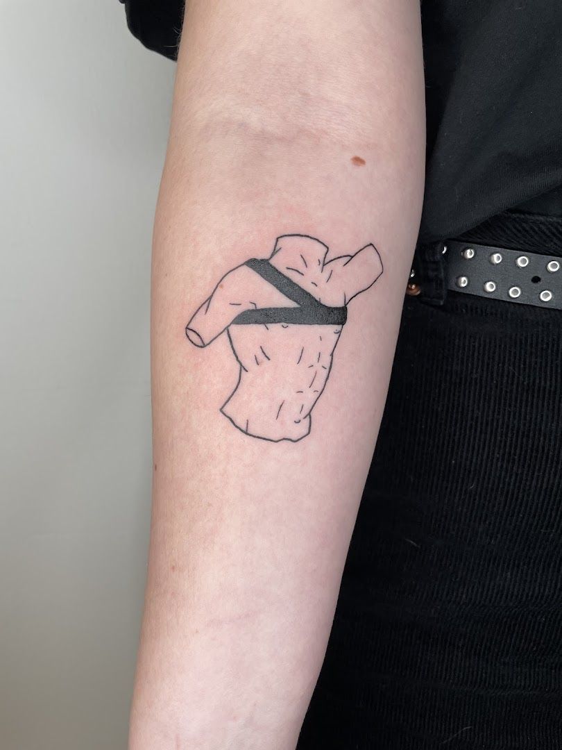 a woman's arm with a black and white cover-up tattoo, essen, germany