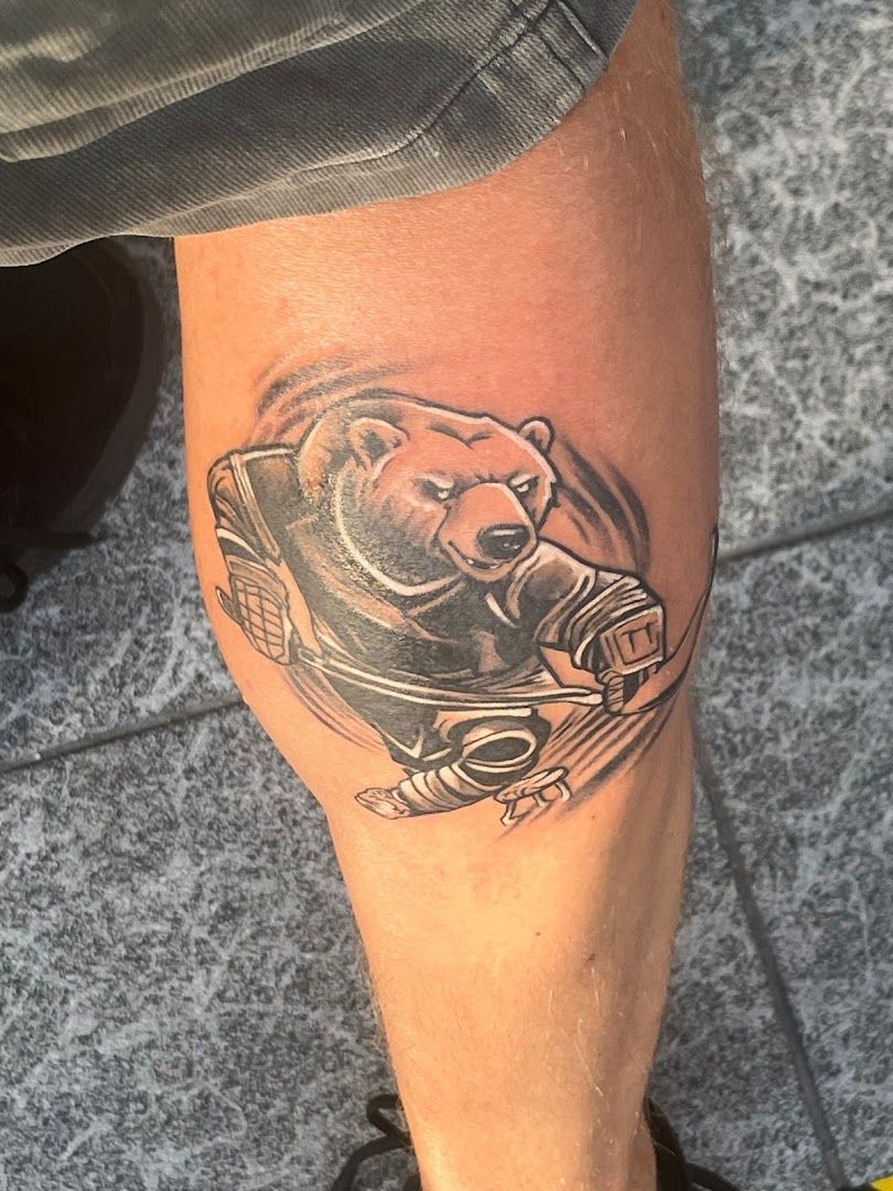 a cover-up tattoo of a bear on the leg, berlin, germany