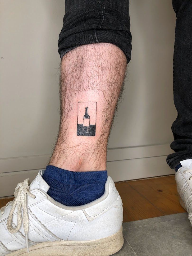 a man's foot with a small narben tattoo on it, stuttgart, germany