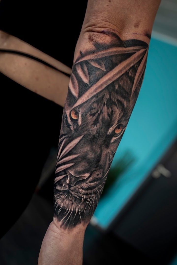 a black and grey cover-up tattoo of a tiger, viersen, germany