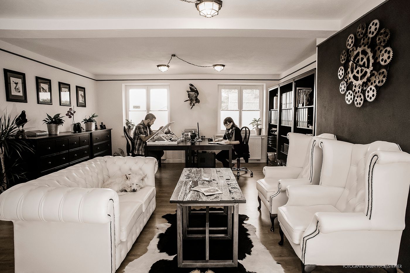 a living room with a couch, a coffee table, and a television