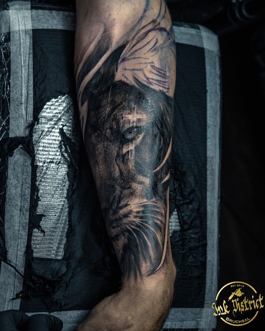 a man's arm with a black and grey cover-up tattoo, karlsruhe, germany