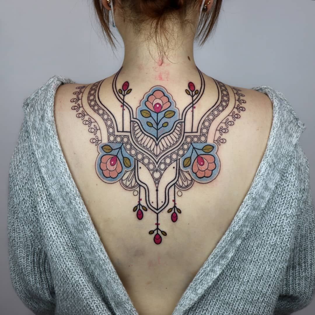 a woman with a narben tattoo on her back, neu-ulm, germany