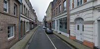 a street with buildings and a car on it