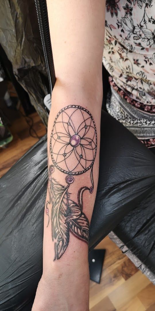 a narben tattoo with a dream catcher on the arm, ravensburg, germany