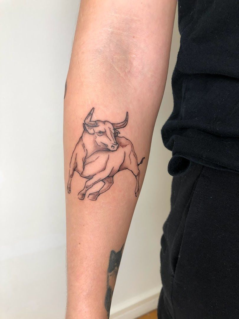 a narben tattoo of a bull on the arm, stuttgart, germany