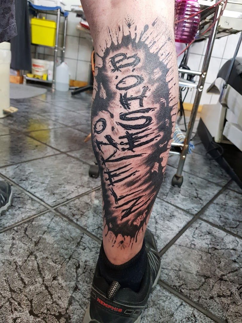 a man with a cover-up tattoo on his leg, weilheim-schongau, germany