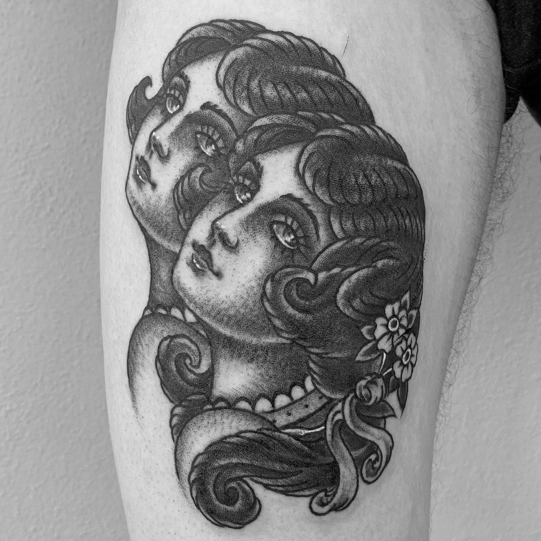 a cover-up tattoo of a woman with a flower in her hair, ravensburg, germany