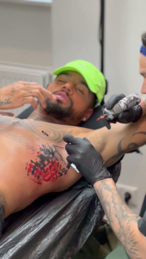 a man getting his trashpolka tattoos done by a tattoo artist, berlin, germany