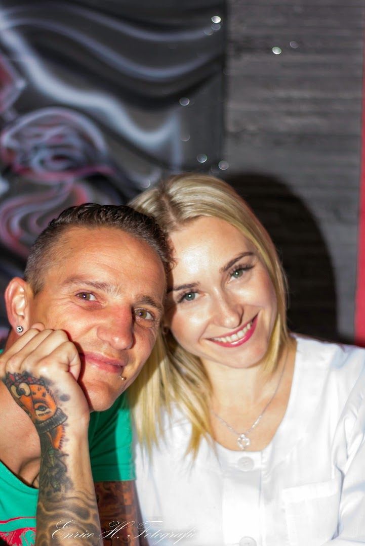a man and woman sitting at a table