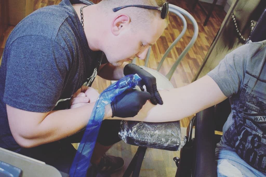 a man with a realistic tattoos on his arm, ansbach, germany