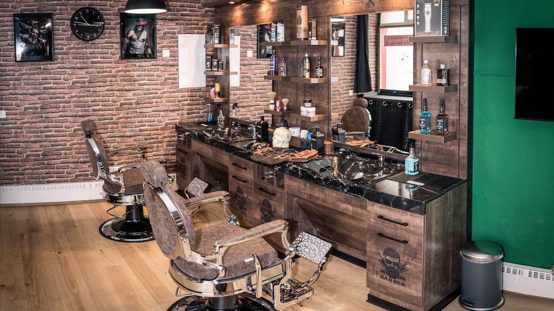 a barber shop with a brick wall and a wooden table