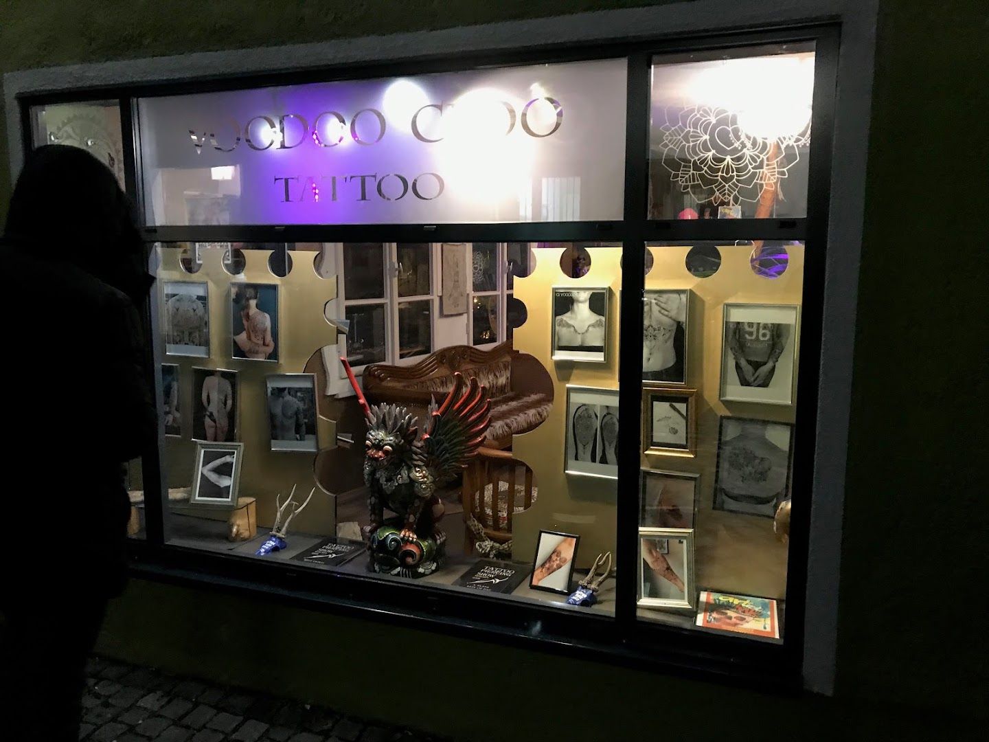 a person standing in front of a store window