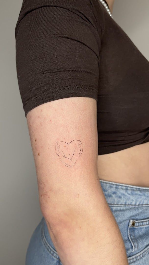 a woman with a small narben tattoo on her arm, berlin, germany