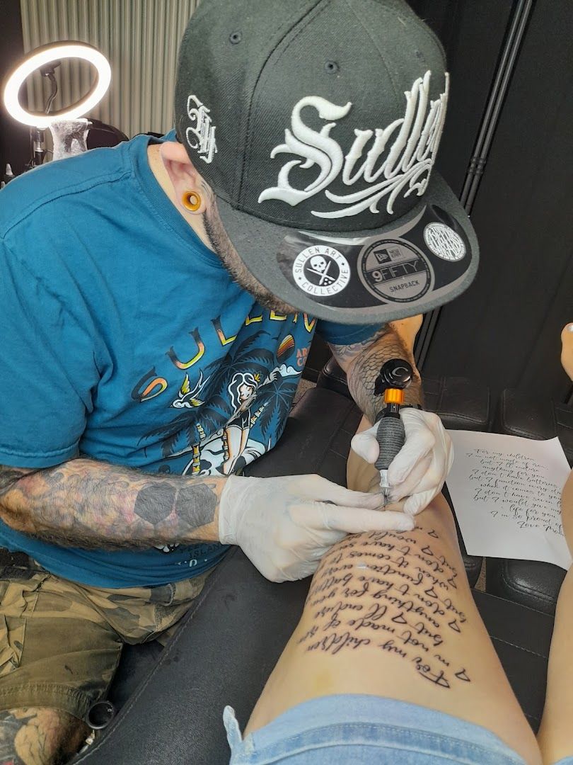 a man getting his blackwork tattoo done by a tattoo artist, neumarkt, germany