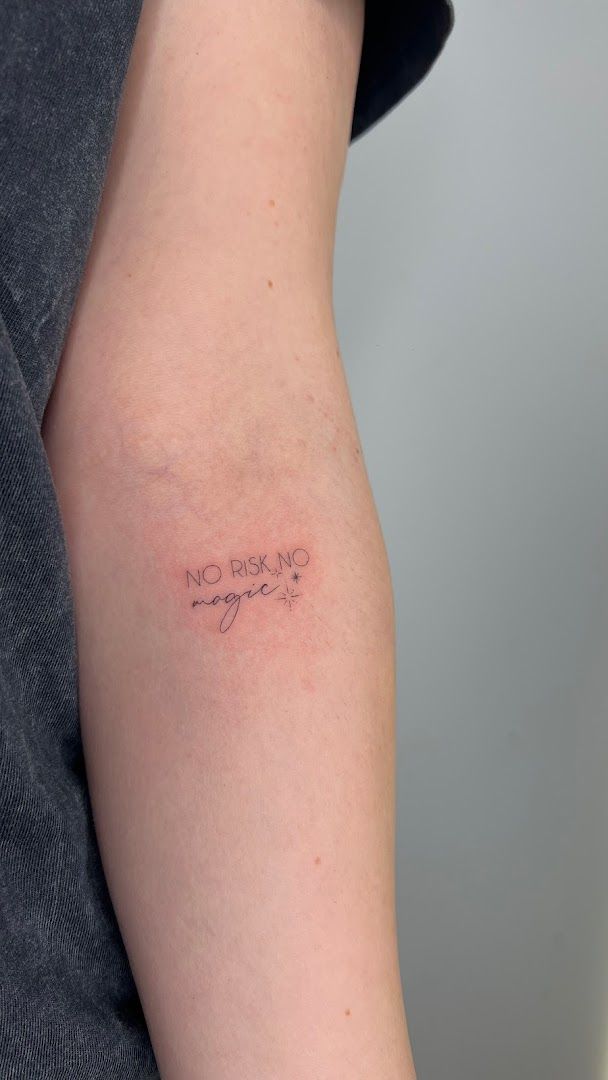 a woman's arm with a japanische tattoos in leipzig saying,'no one ', kreisfreie stadt münster, germany