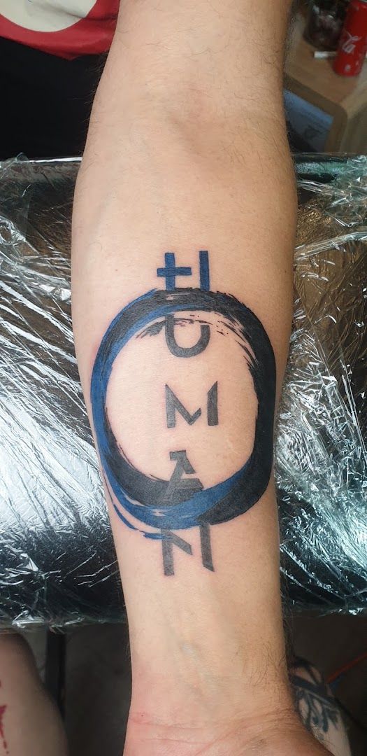 a narben tattoo with a cross and a circle, märkischer kreis, germany