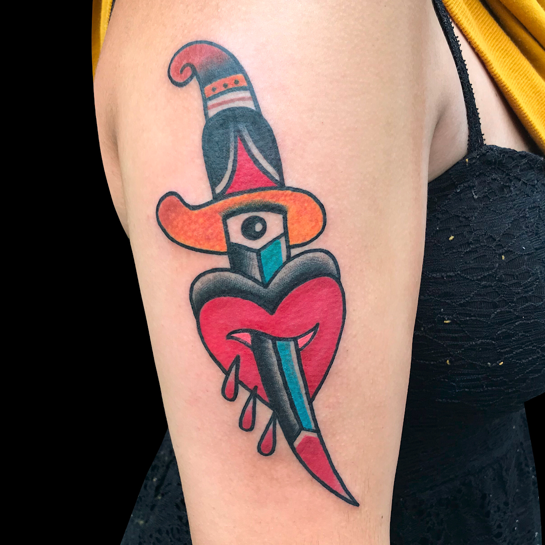 a narben tattoo of a woman with a hat and a knife, dresden, germany