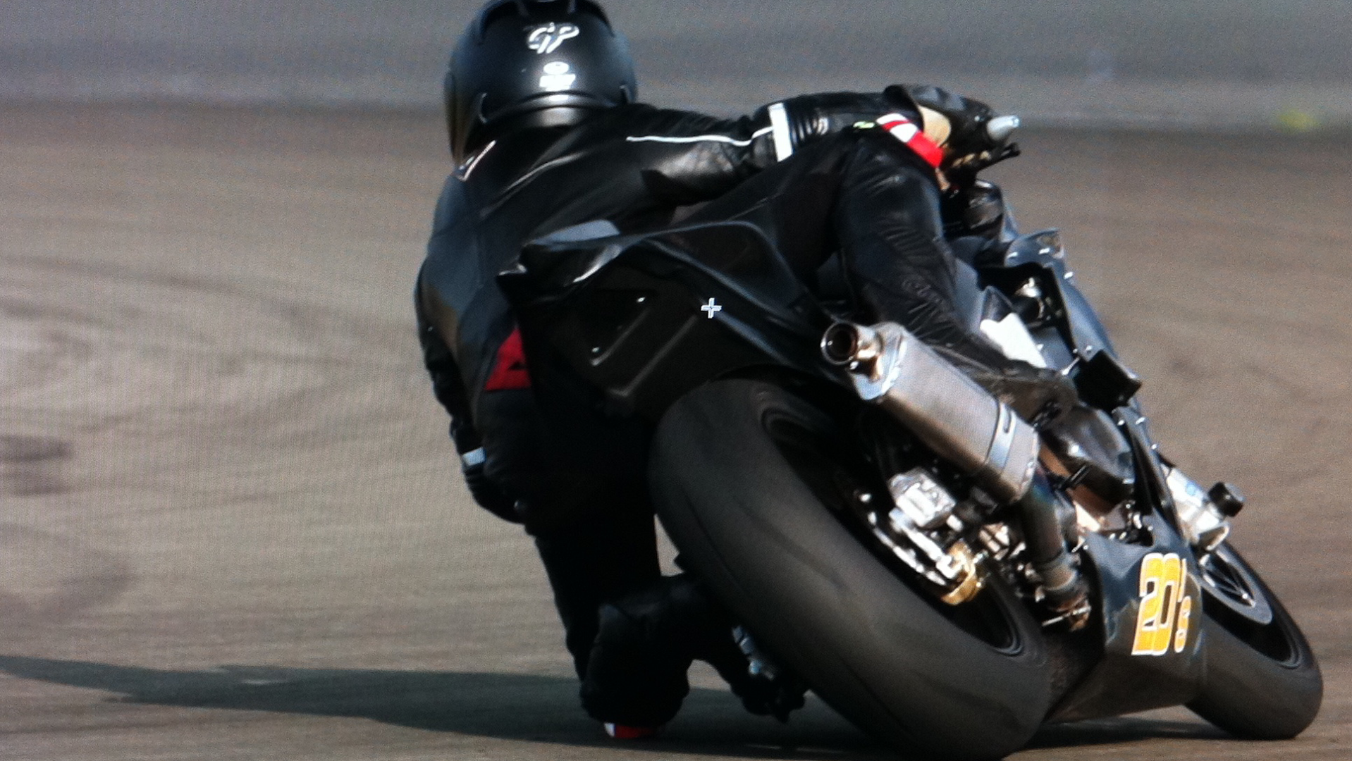 a person on a motorcycle on a track