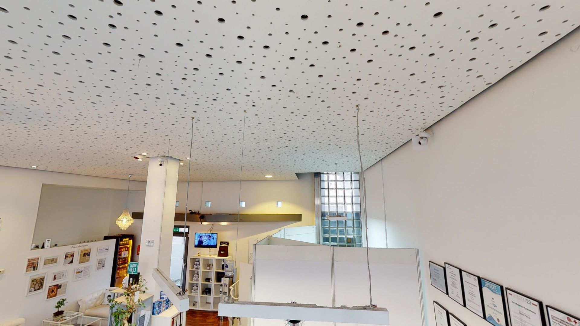 a room with a ceiling covered in holes