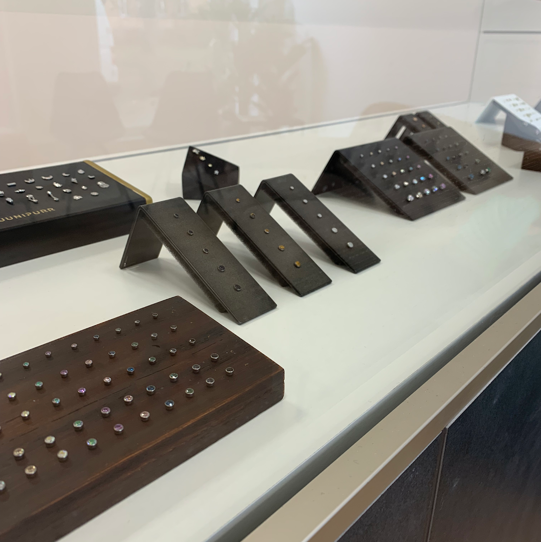 a display of jewelry on a white table